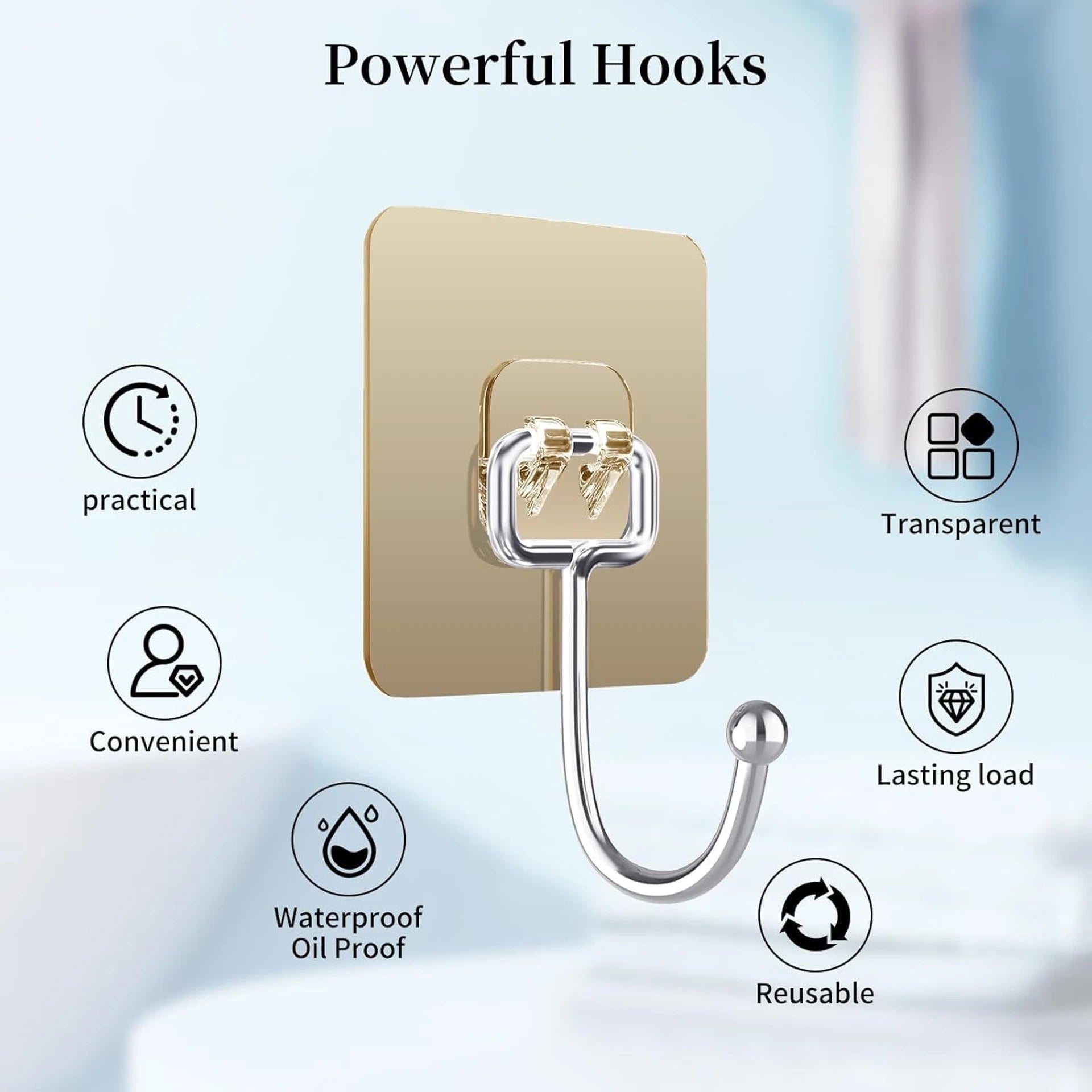 Golden hooks installed on white kitchen tiles holding dish towels and pouches, showing the premium finish against a clean tiled surface