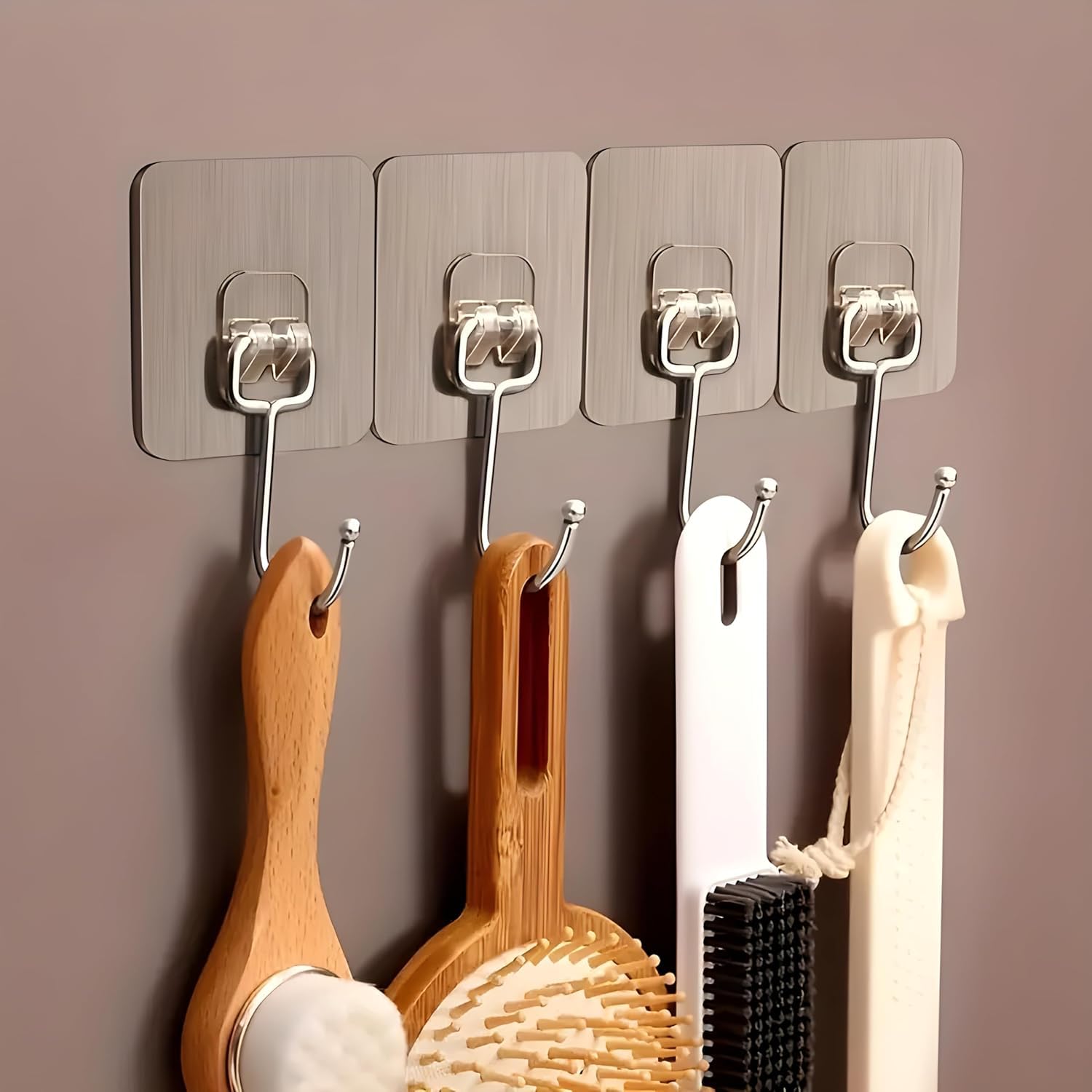 Close-up showing the golden stainless steel hook frame, the warm gold coating, and the pre-applied adhesive backing strip