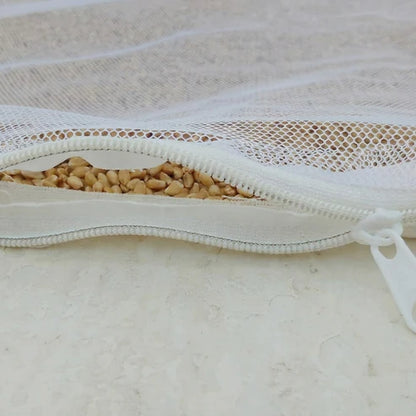 Reusable papad cloth with net showing sun-dried papads ready
