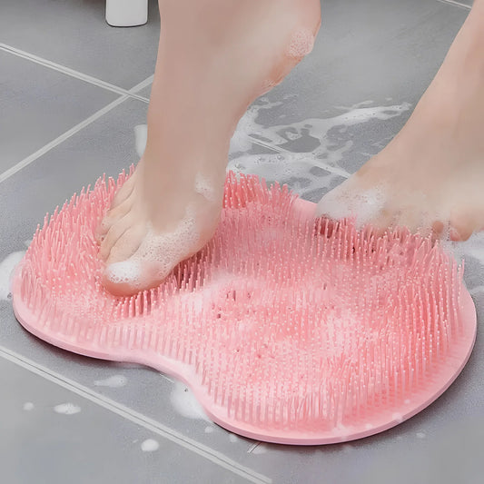 Silicone foot scrubber mat in use on shower floor with soap lather for daily foot cleaning